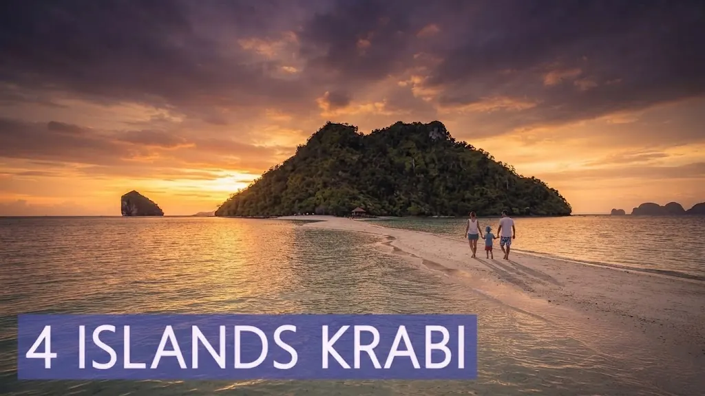 4 Islands Krabi: travellers walking a sandbar toward a forested island at sunset