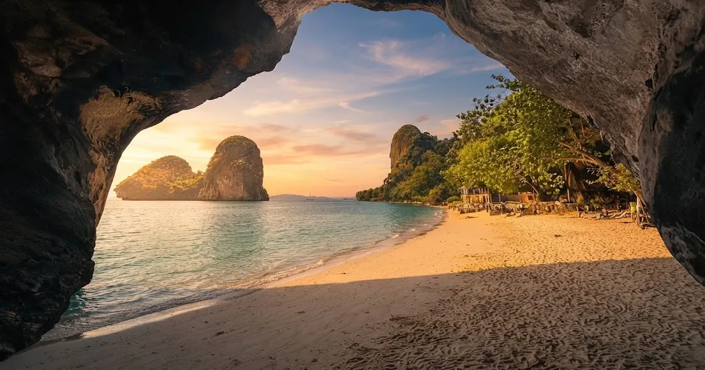 Beach and limestone islets framed by a rock arch at Phra Nang Cave Beach